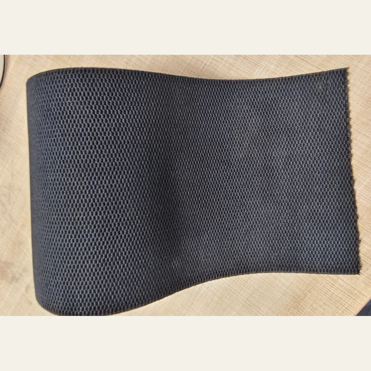 Alternate view of wide black textured flat elastic band with woven surface