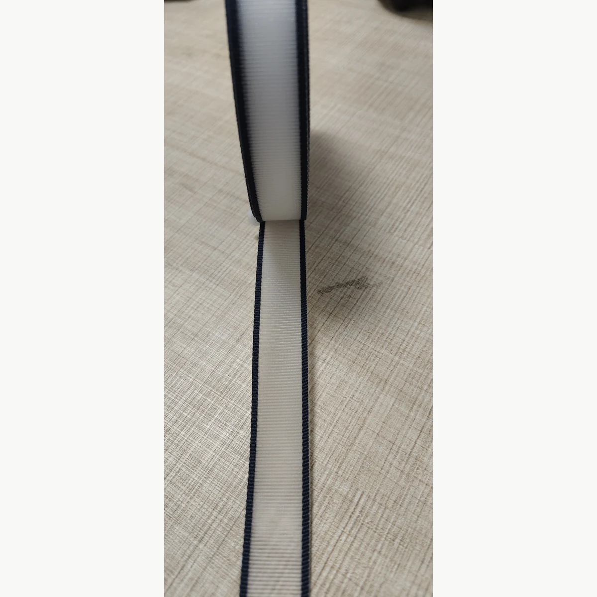 20mm two-tone stiff nylon monofilament webbing with black edges and light center