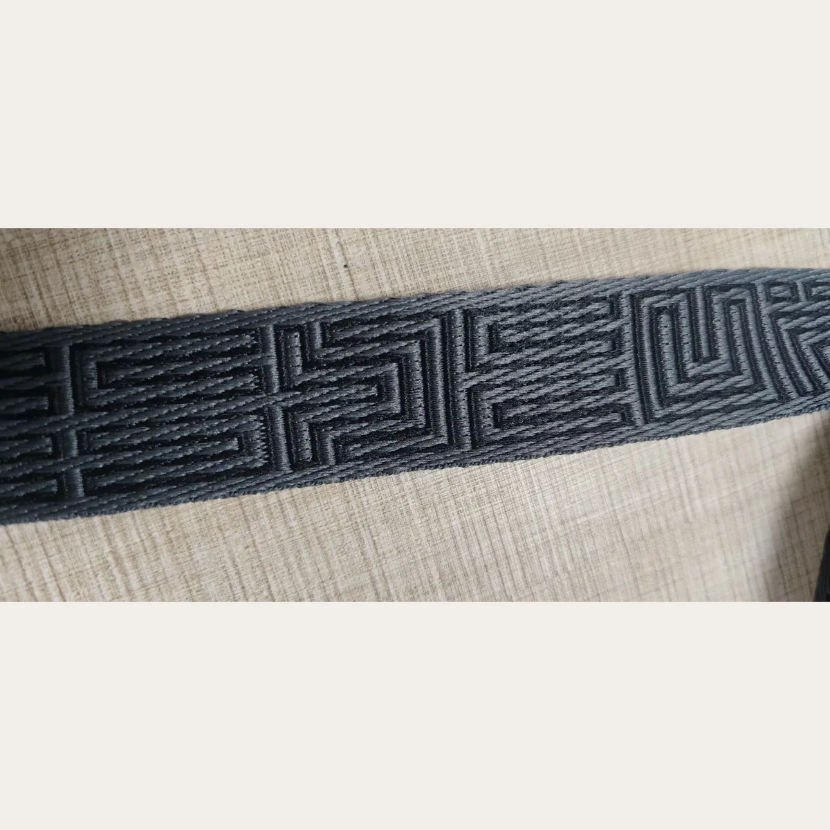 Black polyester jacquard webbing texture detail for custom woven tape