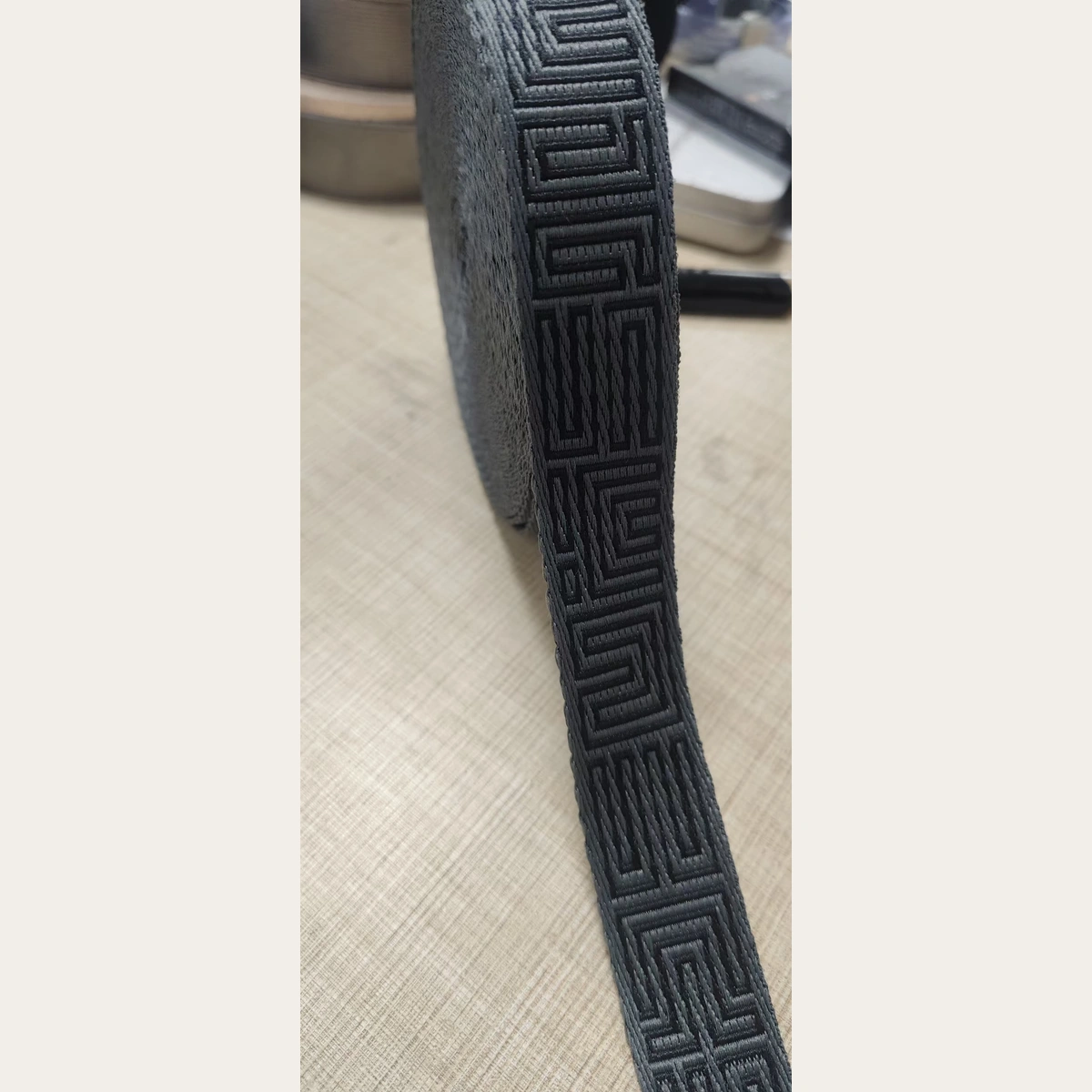 Close up of black 25mm jacquard webbing tape pattern