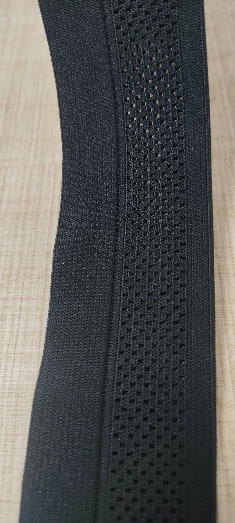 Close-up of the openwork mesh texture on black 35mm elastic band