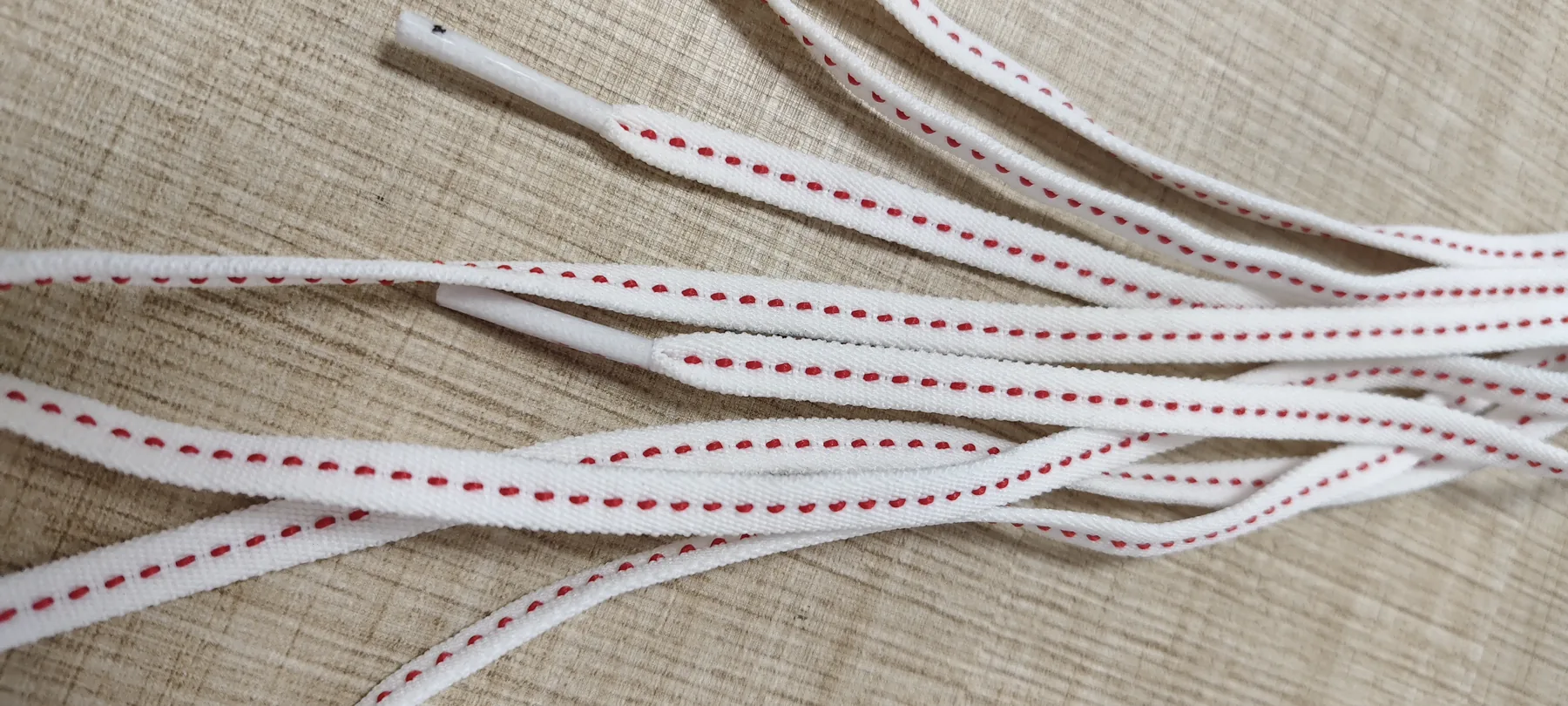 Close-up of red stitched detail on 6mm elastic shoelaces